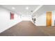 Large finished basement space with carpet and recessed lighting at 2669 N Cherry St, Denver, CO 80207