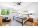 Comfortable bedroom with natural light, neutral walls, and hardwood floors at 2669 N Cherry St, Denver, CO 80207