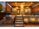 Outdoor porch with steps, stainless grill, modern railing, and wood accents for outdoor living at 2669 N Cherry St, Denver, CO 80207