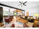 Comfortable living room featuring hardwood floors, large windows, and an open floor plan with nice furniture at 2669 N Cherry St, Denver, CO 80207