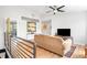 Bright living room featuring wood floors, modern railing, and a cozy sofa at 2669 N Cherry St, Denver, CO 80207