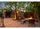 Stylish outdoor patio with a fire pit, comfortable seating, and views of the surrounding landscape at 2669 N Cherry St, Denver, CO 80207