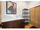 A charming powder room with a modern vanity, black metal shelving, and stylish decor at 2669 N Cherry St, Denver, CO 80207