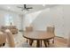 Open floor plan showcasing the dining area with a ceiling fan and adjacent living spaces at 22863 E Tufts Ave # A, Aurora, CO 80015