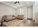 Inviting living room featuring neutral-toned furniture, a ceiling fan, and plenty of natural light at 22863 E Tufts Ave # A, Aurora, CO 80015