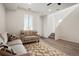 Bright and airy living room with modern decor, featuring a staircase and comfortable seating at 22863 E Tufts Ave # A, Aurora, CO 80015