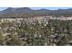 Gorgeous aerial view showing the surrounding mountains and community at 29691 Fairway Dr, Evergreen, CO 80439