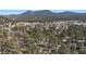 Panoramic aerial shot showcasing the neighborhood and mountain views at 29691 Fairway Dr, Evergreen, CO 80439