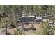 Secluded home nestled among mature pine trees offering privacy and natural beauty at 29691 Fairway Dr, Evergreen, CO 80439