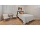 Bright bedroom featuring wood floors, natural light, and tasteful decor at 29691 Fairway Dr, Evergreen, CO 80439
