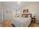 Cozy bedroom with wood floors and ensuite bathroom access at 29691 Fairway Dr, Evergreen, CO 80439