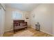 Cozy Bedroom with hardwood floors, a wood crib, and soft accents at 29691 Fairway Dr, Evergreen, CO 80439