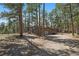 Charming home with a two car garage, surrounded by mature trees and a fenced in lot at 29691 Fairway Dr, Evergreen, CO 80439