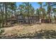 Charming home surrounded by the beauty of nature and mature trees at 29691 Fairway Dr, Evergreen, CO 80439