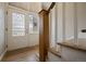 Inviting foyer with leaded glass front door and wood staircase at 29691 Fairway Dr, Evergreen, CO 80439