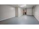 Spacious garage with ample room for parking and storage, featuring both overhead and standard doors at 29691 Fairway Dr, Evergreen, CO 80439