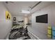 Home gym with an assortment of exercise equipment for convenient fitness routines at 29691 Fairway Dr, Evergreen, CO 80439