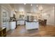 Bright kitchen with stainless appliances, a center island, and an open layout to the dining area at 29691 Fairway Dr, Evergreen, CO 80439