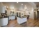 Stylish kitchen with a functional island, modern appliances, and open access to the dining area at 29691 Fairway Dr, Evergreen, CO 80439