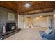 Inviting living room with brick fireplace and adjacent play area for versatile living at 29691 Fairway Dr, Evergreen, CO 80439