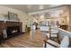 Spacious living area with open kitchen, wood burning fireplace, and ample natural light at 29691 Fairway Dr, Evergreen, CO 80439