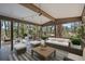 Covered patio with comfortable seating, perfect for outdoor relaxation and entertaining at 29691 Fairway Dr, Evergreen, CO 80439