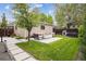 Inviting backyard patio area with stylish outdoor seating and a modern fire pit feature at 1526 S Gaylord St, Denver, CO 80210