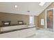 Bright bathroom featuring a soaking tub and a glass-enclosed shower at 1526 S Gaylord St, Denver, CO 80210