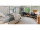 Bedroom with a sloped ceiling, a workstation, and a large window for natural light at 1526 S Gaylord St, Denver, CO 80210