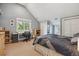 Well-lit bedroom featuring a desk, a window view, and plenty of closet space at 1526 S Gaylord St, Denver, CO 80210