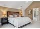 Bedroom with vaulted ceiling, well-lit with modern lamps and neutral-toned walls at 1526 S Gaylord St, Denver, CO 80210