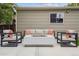 Cozy backyard seating area with a modern firepit, perfect for outdoor entertaining at 1526 S Gaylord St, Denver, CO 80210