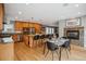 Spacious kitchen and dining area with modern stainless steel appliances and an inviting fireplace at 1526 S Gaylord St, Denver, CO 80210