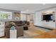 Bright living room with built-in cabinets, stylish decor, and comfortable seating area at 1526 S Gaylord St, Denver, CO 80210
