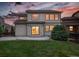 The backyard features a patio area and a well-maintained lawn, perfect for outdoor entertaining at 21482 E Idyllwilde Dr, Parker, CO 80138