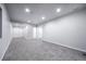 The unfinished basement features carpeted floors, neutral paint, and multiple doorways at 21482 E Idyllwilde Dr, Parker, CO 80138