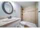 The bathroom features tile flooring, tub, shower, and round mirror at 21482 E Idyllwilde Dr, Parker, CO 80138