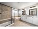 Bathroom featuring double sinks, soaking tub, and a tiled shower stall at 21482 E Idyllwilde Dr, Parker, CO 80138