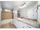 Bathroom with granite countertop, tile flooring, and combined shower and bathtub at 21482 E Idyllwilde Dr, Parker, CO 80138