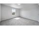 This bedroom is complete with neutral paint, window for natural light, and carpeted floors at 21482 E Idyllwilde Dr, Parker, CO 80138