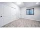 The bedroom features carpeted floors, neutral paint, window for natural light, and sliding closet doors at 21482 E Idyllwilde Dr, Parker, CO 80138