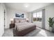 Comfortable bedroom with a large window allowing ample natural light and a beautiful view of the neighborhood at 21482 E Idyllwilde Dr, Parker, CO 80138