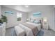 Bright bedroom featuring neutral paint, a large window and light, clean decor at 21482 E Idyllwilde Dr, Parker, CO 80138