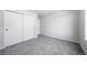 This bedroom features carpeted floors, neutral paint, and closet with sliding doors at 21482 E Idyllwilde Dr, Parker, CO 80138