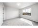 Bright bedroom with large window offering neighborhood views and neutral carpet at 21482 E Idyllwilde Dr, Parker, CO 80138
