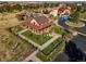 A large community clubhouse with a covered porch and a well-maintained lawn at 21482 E Idyllwilde Dr, Parker, CO 80138