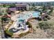 A community pool with a slide, splash pad, and plenty of seating for residents to enjoy at 21482 E Idyllwilde Dr, Parker, CO 80138