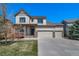 Beautiful home with a covered front porch, three-car garage, and well-maintained landscaping at 21482 E Idyllwilde Dr, Parker, CO 80138
