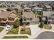 A beautiful two-story home with a well-manicured lawn and a spacious three-car garage at 21482 E Idyllwilde Dr, Parker, CO 80138