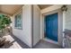 A charming front porch with a vibrant blue front door, creating a welcoming entrance at 21482 E Idyllwilde Dr, Parker, CO 80138